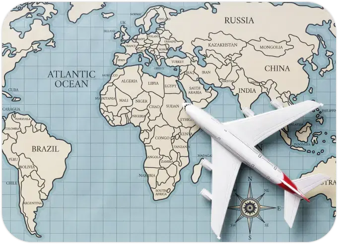 Top view of a world map with a toy airplane, representing global API integration for eSIM and SIM card services